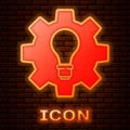 Glowing neon Light bulb and gear icon isolated on brick wall background. Innovation concept. Business idea. Vector Royalty Free Stock Photo