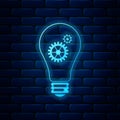 Glowing neon Light bulb and gear inside icon isolated on brick wall background. Innovation concept. Vector Royalty Free Stock Photo