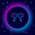 Glowing neon line Air headphones icon icon isolated on black background. Holder wireless in case earphones garniture Royalty Free Stock Photo