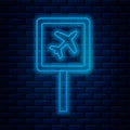 Glowing neon line Airport icon isolated on brick wall background. Vector Royalty Free Stock Photo