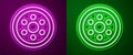 Glowing neon line Alloy wheel for a car icon isolated on purple and green background. Vector