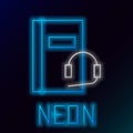 Glowing neon line Audio book icon isolated on black background. Book with headphones. Audio guide sign. Online learning Royalty Free Stock Photo