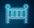 Glowing neon line Baby crib cradle bed icon isolated on blue background. Vector Royalty Free Stock Photo