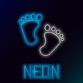 Glowing neon line Baby footprints icon isolated on black background. Baby feet sign. Colorful outline concept. Vector Royalty Free Stock Photo