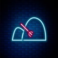 Glowing neon line Bale of hay and rake icon isolated on brick wall background. Colorful outline concept. Vector Royalty Free Stock Photo