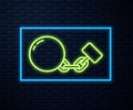 Glowing neon line Ball on chain icon isolated on brick wall background. Vector