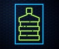 Glowing neon line Big bottle with clean water icon isolated on brick wall background. Plastic container for the cooler Royalty Free Stock Photo