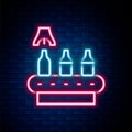 Glowing neon line Brewery factory production line pouring alcoholic drink in glass bottles icon isolated on brick wall Royalty Free Stock Photo