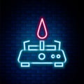 Glowing neon line Camping gas stove icon isolated on brick wall background. Portable gas burner. Hiking, camping Royalty Free Stock Photo