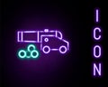 Glowing neon line Cannon with cannonballs icon isolated on black background. Medieval weapons. Colorful outline concept