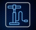 Glowing neon line Car air pump icon isolated on brick wall background. Vector Royalty Free Stock Photo