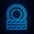 Glowing neon line Car tire wheel icon isolated on brick wall background. Vector Royalty Free Stock Photo