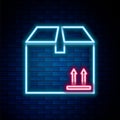 Glowing neon line Cardboard box with traffic symbol icon isolated on brick wall background. Box, package, parcel sign Royalty Free Stock Photo