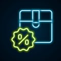 Glowing neon line Carton cardboard box with discount percent tag icon isolated on black background. Box, package, parcel Royalty Free Stock Photo