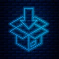 Glowing neon line Carton cardboard box icon isolated on brick wall background. Box, package, parcel sign. Delivery and Royalty Free Stock Photo