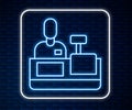 Glowing neon line Cashier at cash register supermarket icon isolated on brick wall background. Shop assistant, cashier