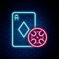 Glowing neon line Casino chip and playing cards icon isolated on brick wall background. Casino poker. Colorful outline Royalty Free Stock Photo
