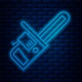 Glowing neon line Chainsaw icon isolated on brick wall background. Vector Illustration Royalty Free Stock Photo