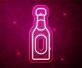 Glowing neon line Champagne bottle icon isolated on red background. Vector