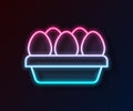 Glowing neon line Chicken egg in box icon isolated on black background. Vector