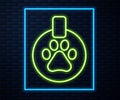 Glowing neon line Collar with name tag icon isolated on brick wall background. Supplies for domestic animal. Dog or cat