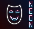 Glowing neon line Comedy theatrical mask icon isolated on black background. Colorful outline concept. Vector