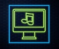 Glowing neon line Computer with music note symbol on screen icon isolated on brick wall background. Vector Royalty Free Stock Photo