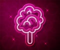 Glowing neon line Cotton candy icon isolated on red background. Vector