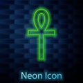 Glowing neon line Cross ankh icon isolated on brick wall background. Vector