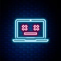 Glowing neon line Dead laptop icon isolated on brick wall background. 404 error like laptop with dead emoji. Fatal error Royalty Free Stock Photo