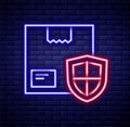 Glowing neon line Delivery security with shield icon isolated on brick wall background. Delivery insurance. Insured Royalty Free Stock Photo