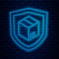Glowing neon line Delivery security with shield icon isolated on brick wall background. Delivery insurance. Insured Royalty Free Stock Photo
