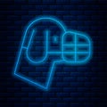 Glowing neon line Dog in muzzle icon isolated on brick wall background. Accessory for dog. Vector