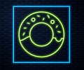 Glowing neon line Donut with sweet glaze icon isolated on brick wall background. Vector Illustration