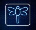 Glowing neon line Dragonfly icon isolated on brick wall background. Vector Royalty Free Stock Photo