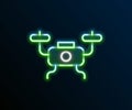 Glowing neon line Drone flying icon isolated on black background. Quadrocopter with video and photo camera symbol