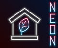 Glowing neon line Eco friendly house icon isolated on black background. Eco house with leaf. Colorful outline concept Royalty Free Stock Photo