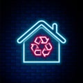 Glowing neon line Eco House with recycling symbol icon isolated on brick wall background. Ecology home with recycle Royalty Free Stock Photo