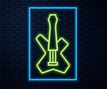 Glowing neon line Electric bass guitar icon isolated on brick wall background. Vector Royalty Free Stock Photo