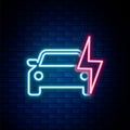 Glowing neon line Electric car and electrical cable plug charging icon isolated on brick wall background. Renewable eco Royalty Free Stock Photo