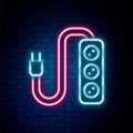 Glowing neon line Electric extension cord icon isolated on brick wall background. Power plug socket. Colorful outline Royalty Free Stock Photo