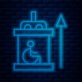 Glowing neon line Elevator for disabled icon isolated on brick wall background. Vector