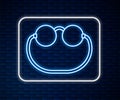 Glowing neon line Eyeglasses icon isolated on brick wall background. Vector