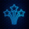 Glowing neon line Firework icon isolated on brick wall background. Concept of fun party. Explosive pyrotechnic symbol Royalty Free Stock Photo