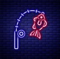 Glowing neon line Fishing rod and fish icon isolated on brick wall background. Fishing equipment and fish farming topics