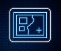 Glowing neon line Folded map icon isolated on brick wall background. Vector