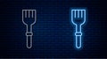 Glowing neon line Fork icon isolated on brick wall background. Cutlery symbol. Vector