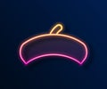 Glowing neon line French beret icon isolated on black background. Vector