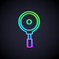 Glowing neon line Frying pan icon isolated on black background. Fry or roast food symbol. Vector