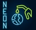 Glowing neon line Fuel nozzle pumping oil or petrol from planet Earth icon isolated on black background. Ecological